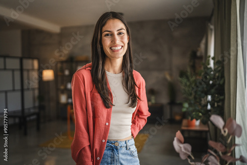 Portrait of beautiful adult young women stand and smile at home