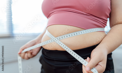 Obese Woman with fat upset about her belly. Overweight woman touching his fat belly and want to lose weight. Fat woman worried about weight diet lifestyle.