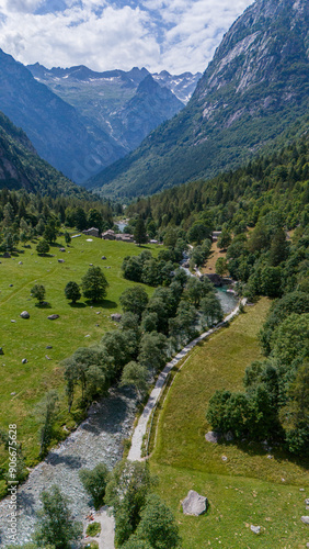 Aerial view of Val di Mello, a green valley surrounded by granite mountains and woods, renamed the Italian Yosemite Valley by nature lovers. Val Masino, Valtellina, Sondrio. Italy