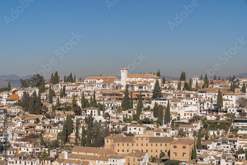 San Pedro neighborhood in the city of Granada, Spain on a sunny day with blue sky in the background