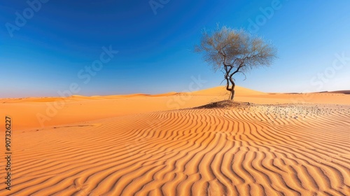 A solitary tree stands in the middle of a vast desert with rippled sand dunes under a clear blue sky, symbolizing resilience and isolation..