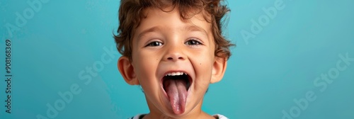 Child boy displaying the trait of folding tongue