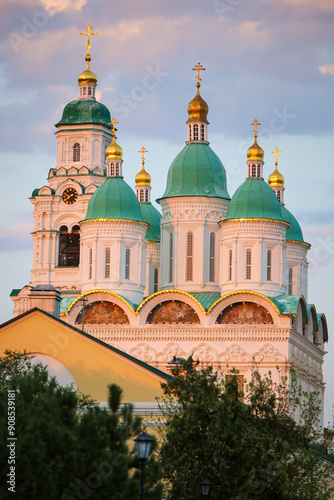 View of the domes of the Assumption Cathedral and the Prechistenskaya bell tower of the Astrakhan Kremlin on a summer evening