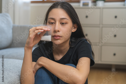 Anti drugs, drug addict asian young woman, girl hand holding heroin or cocaine in plastic bag, use narcotic at home, abuse overdose. Sick pain of health, unhealthy people. Suicide depressed or despair