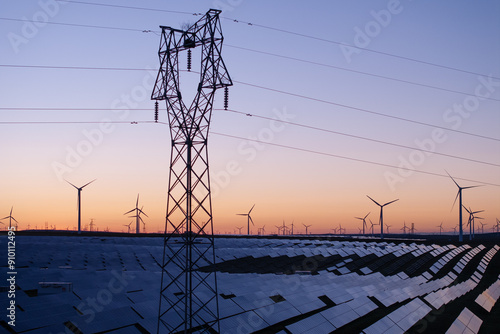 power pylon in solar power station at sunset