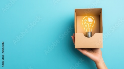 Think outside the box, creativity improvement, idea development, finding innovative solution, light bulb in a box, copy space