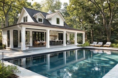 Classic pool house with open-air lounge, lush greenery, and sparkling pool behind a large white farmhouse in New England, mid-summer, captured with Canon EOS R5.