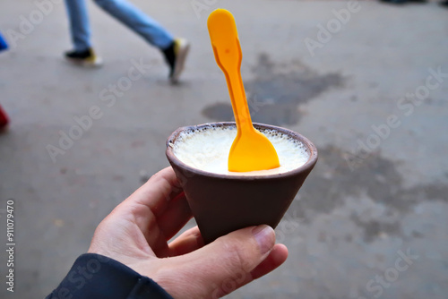 A small clay pot filled with Juju Dhau, king of yoghurt, a traditional type of curd, yoghurt from Bhaktapur, Nepal