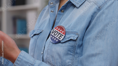 Active citizen with a vote button campaigning for a political party before elections