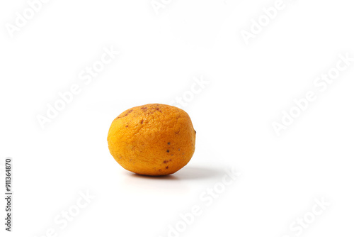 wrinkled orange, stored in the refrigerator, isolated on white background