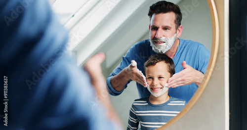 Shaving cream, bathroom and dad with son or reflection, happy and playful practice for growth or development. Father, boy and mirror in home for learning facial care, grooming and bonding with love.