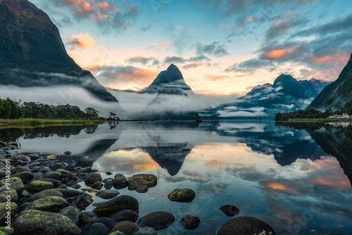 Milford Sound with Mitre peak in foggy on the lake during the morning at New Zealand