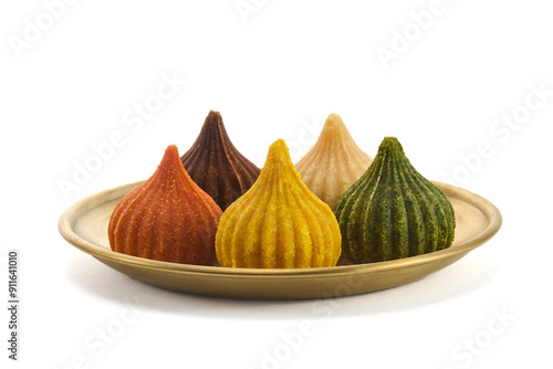 Ganesh Chaturthi Festival. Colorful Modaks Indian sweet dumpling on Plate