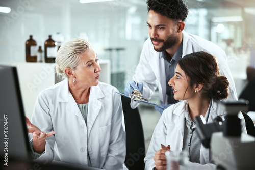 Computer, discussion and manager with scientists in lab for pharmaceutical innovation with drug trial. Research, help and mentor with biomedical students with internship for analytical chemistry.