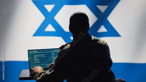 Israel intelligence agency operator uses program deploying bots on social networks, smearing political opponents. Israeli Mossad agent engages in cognitive warfare using troll accounts, camera A