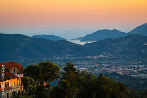 Beautiful twilight sky over the cities of Sarzana, La Spezia, Porto Venere and surrounding mountains at the Ligurian coast, Italy