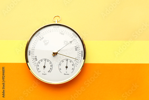 Aneroid barometer on colorful background