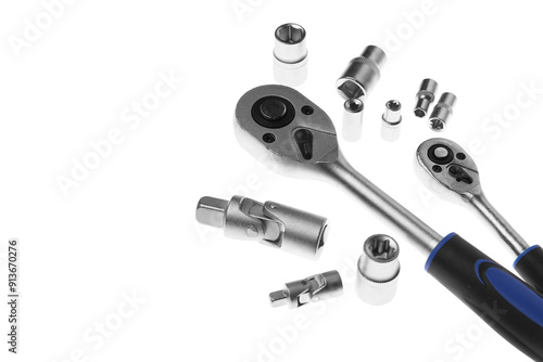 Two torque wrenches and nuts on white background. Auto mechanic tools