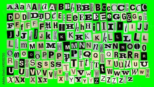 collage alphabet, letters cut out from magazine on a green background, black and white retro style