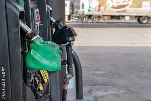 Close up view of green diesel gas pump at gas station with copy space.