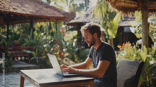 Young digital nomad working remotely on his laptop in Bali Freelancer Man in workation video call Travel and remote online work Outdoor in the garden desk for remote workers someone a : Generative AI