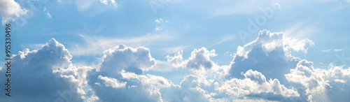 White curly clouds illuminated by the bright sun