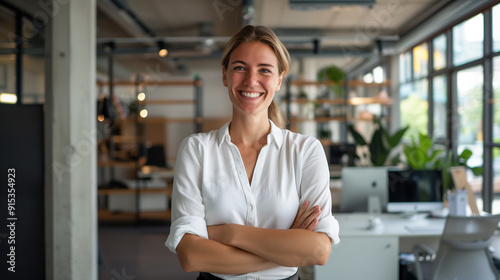 Portrait of a smiling female Australian startup founder in their 30s standing in a modern office interior