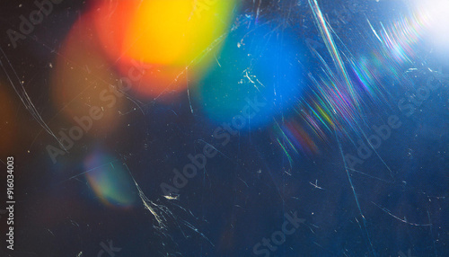 Dust scratches overlay. Old film effect. Blue distressed faded glass with smeared dirt stains colorful rainbow lens flare design. harsh for creative cover photograph