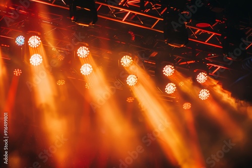 Close-up of illuminated stage lights in concert venue, showcasing dynamic performance and entertainment