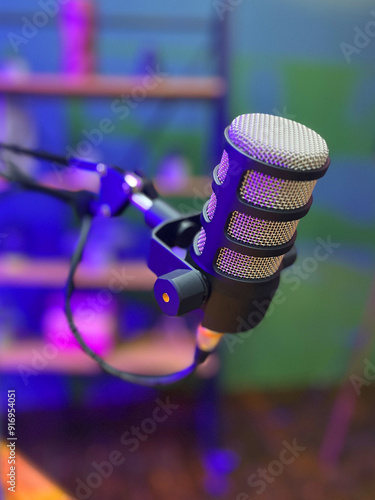 Professional microphone at a radio station or studio, entertainment and communication concept. Podcast, live, bright lights