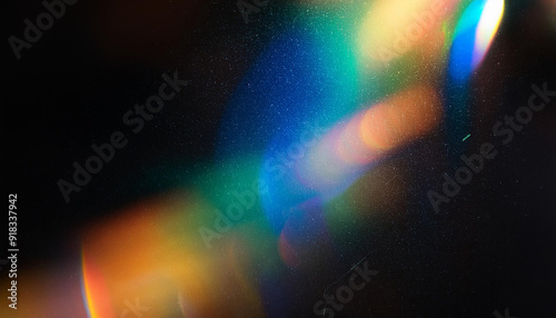 Abstract Light Refraction on Black Background. Spectrum of Rainbow Colors Blurred by Lens Flare, Featuring Vibrant Red, Orange, Green, and Blue Hues in a Soft, Ethereal Glow