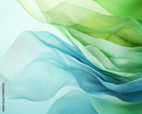 Ethereal Flowing Layers of Sheer Fabric in Green and Blue Hues Creating a Serene Abstract Design at Midday