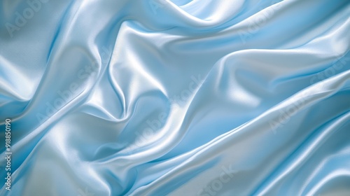 A texture of solid light blue silk satin fabric, showcasing a duchess satin with a luxurious sheen. 