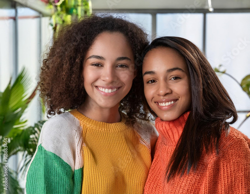 Joyful and Warm Portrait of Diverse, Biracial, Mixed Ethnicity, Loving, and Happy Sisters Sharing a Beautiful Moment Together