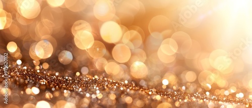  gold glitter against a white and brown background, with a soft focus effect and a bokeh of light originating from the top