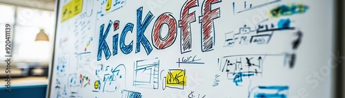 A whiteboard covered with colorful doodles and notes, prominently featuring the word "Kickoff," indicating a brainstorming session or project launch