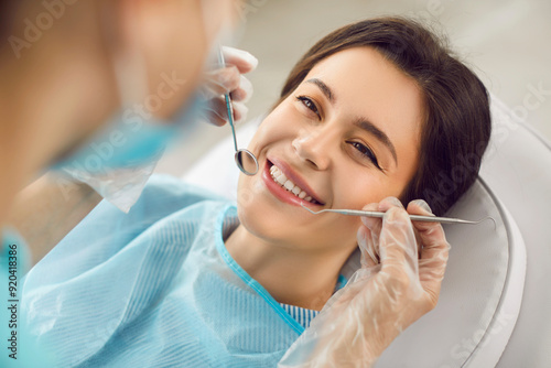 Dentistry, dentist clinic appointment for happy smiling woman, healthy smile, teeth regular checkup. Working with female patient in dentist office using professional tools, health care and medicare 