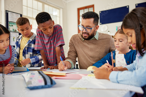 Teacher checking pupil notebooks