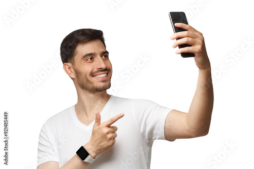 Young handsome man in white t-shirt holding phone and taking selfie photo