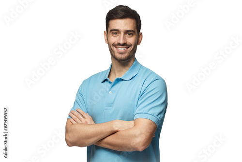 Portrait of young european man standing in blue polo shirt with crossed arms, smiling and looking at camera