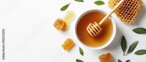 Honeycomb, Honey, Dipper and Green Leaves on White Background