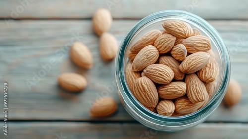 Glass jar showcasing whole, unprocessed almonds