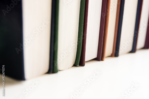 a line of hymnals on a shelf