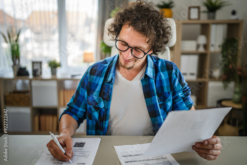 Adult confident man sit at office and write, sign on document