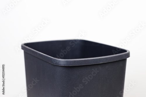 black trash can on a white background