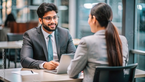 Indian HR specialist conducting a recruitment interview with a candidate. 