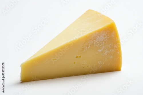 Aged cheddar cheese wedge on a light background