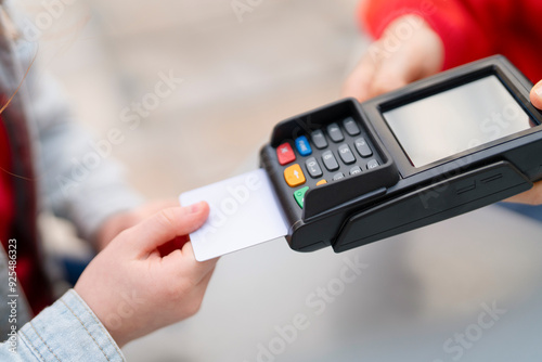 Person Using Card Reader to Process Payment Outdoors During Daylight