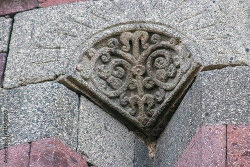 Ornate stone carvings on the Emir Saltuk Tomb in Erzurum, depicting the Tree of Life, symbolizing immortality and the connection between the heavens, earth, the underworld in ancient Turkish culture.