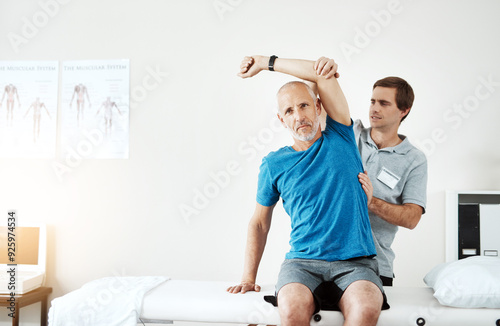 Elderly, physiotherapist or man stretching in arm rehabilitation in office for knee injury for orthopedic support. Shoulder, senior or professional pt for physiotherapy, mobility or muscle recovery